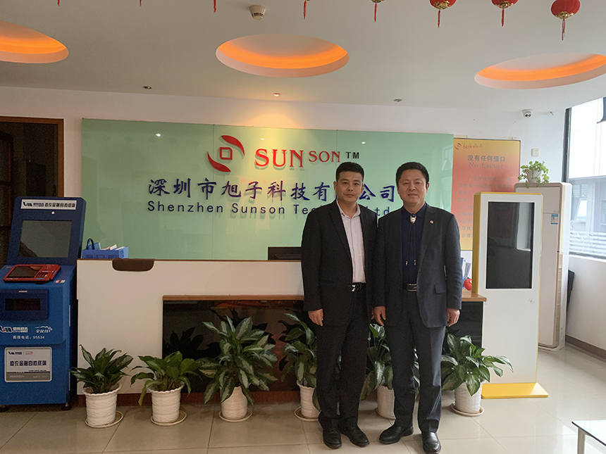 王永峰董事長和敖虎山委員合影